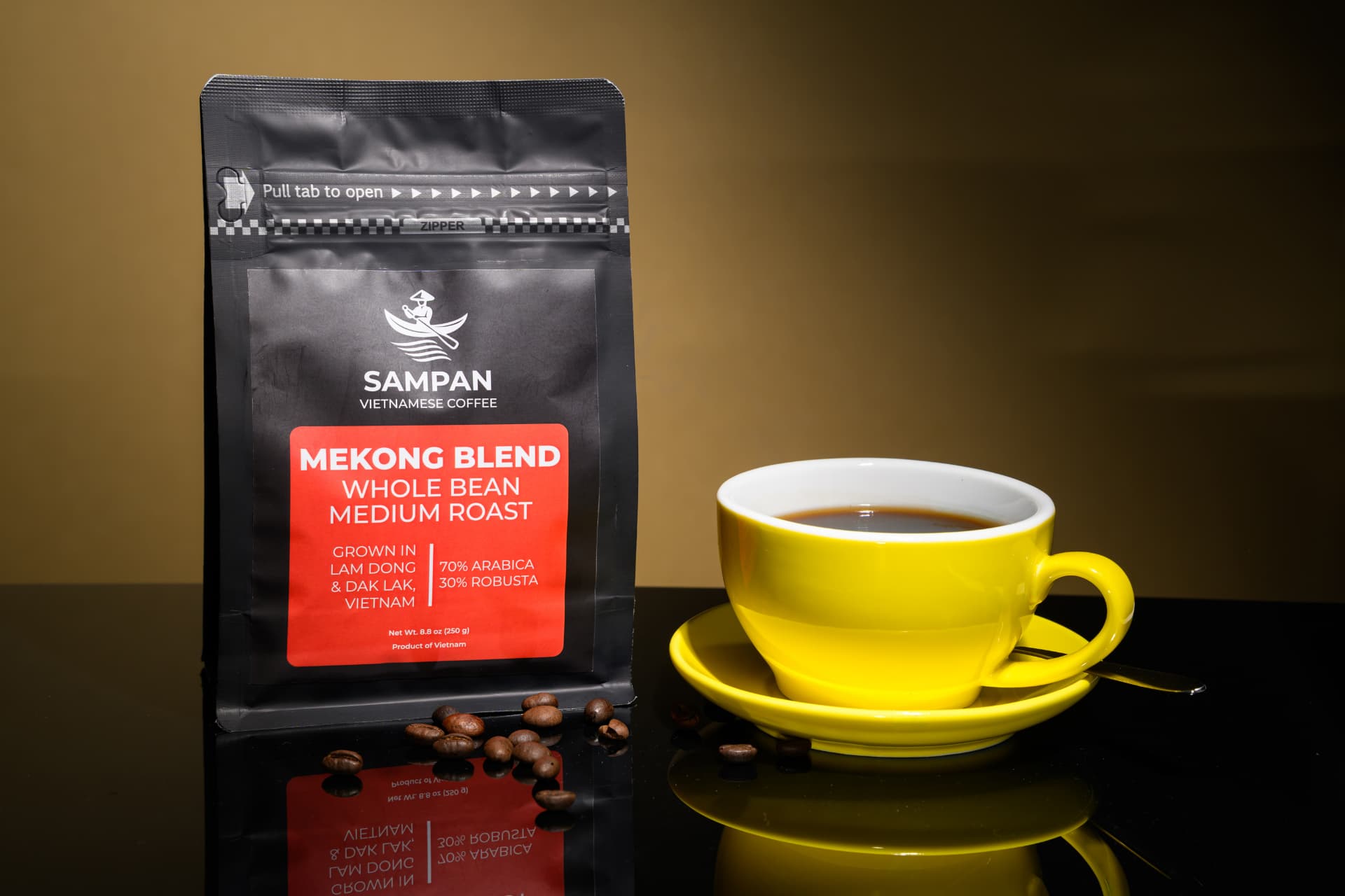 Sampan Mekong Blend coffee bag standing beside a yellow cup of brewed Vietnamese coffee
