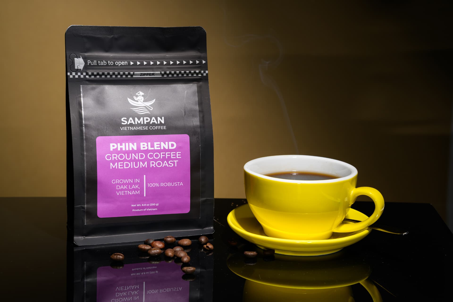 Sampan Phin Blend coffee bag standing beside a yellow cup of brewed Vietnamese coffee